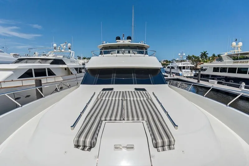 Slide: The Image of 2012 Ocean Alexander 90 Skylounge Motoryacht docked, featuring spacious deck and sleek design. - 22