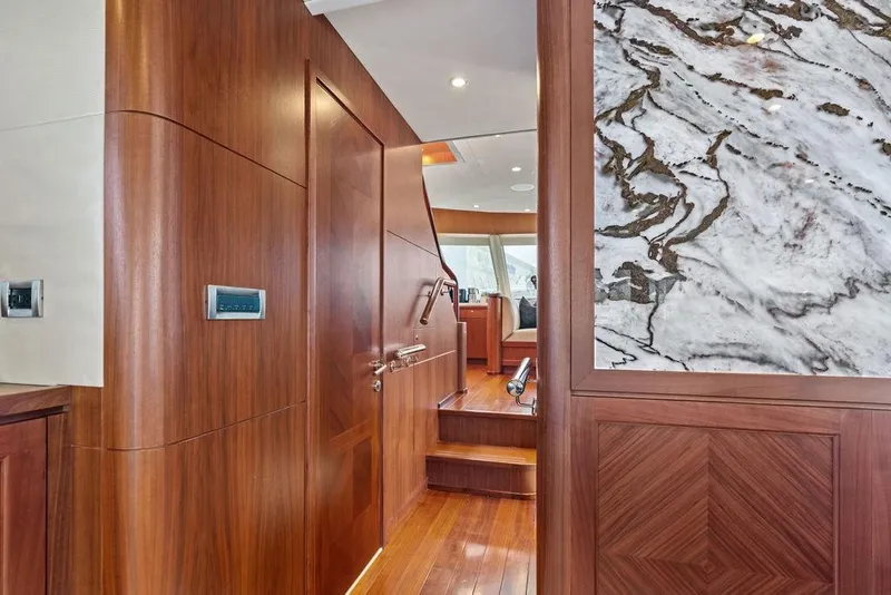 Slide: The Image of Luxurious interior of 2012 Ocean Alexander 90 Skylounge Motoryacht with wood and marble accents. - 55