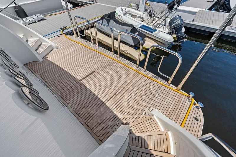 Slide: The Image of Luxurious deck of 2012 Ocean Alexander 90 Skylounge Motoryacht at marina. - 12