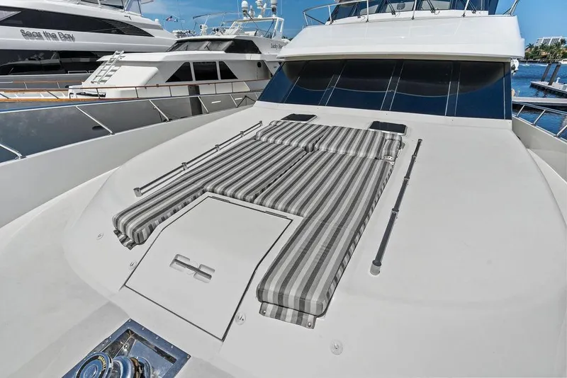 Slide: The Image of Luxurious 2012 Ocean Alexander 90 Skylounge Motoryacht with striped sun pads on deck. - 23