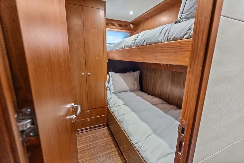 Slide: The Image of Bunk beds in 2012 Ocean Alexander 90 Skylounge Motoryacht cabin with wooden interior. - 93