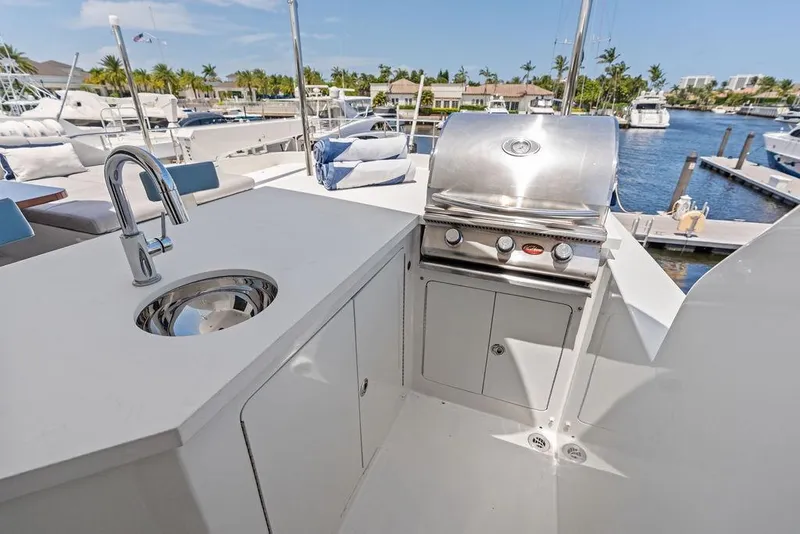 Slide: The Image of Outdoor kitchen on 2012 Ocean Alexander 90 Skylounge Motoryacht with sink and grill. - 29