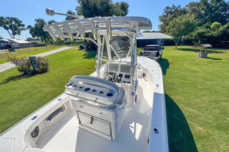 Slide: The Image of 2026 SeaVee 270Z boat with advanced controls, parked on a grassy lawn. - 10