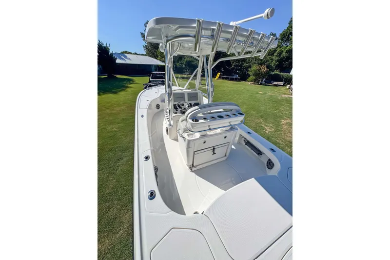 Slide: The Image of 2026 SeaVee 270Z boat with center console and T-top on grassy area. - 11