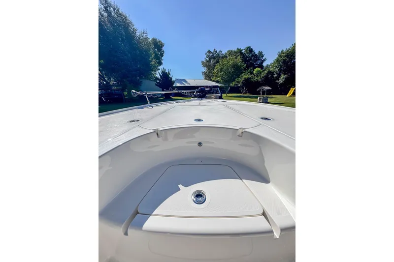 Slide: The Image of 2026 SeaVee 270Z boat deck, showcasing sleek design and spacious layout under clear blue sky. - 17