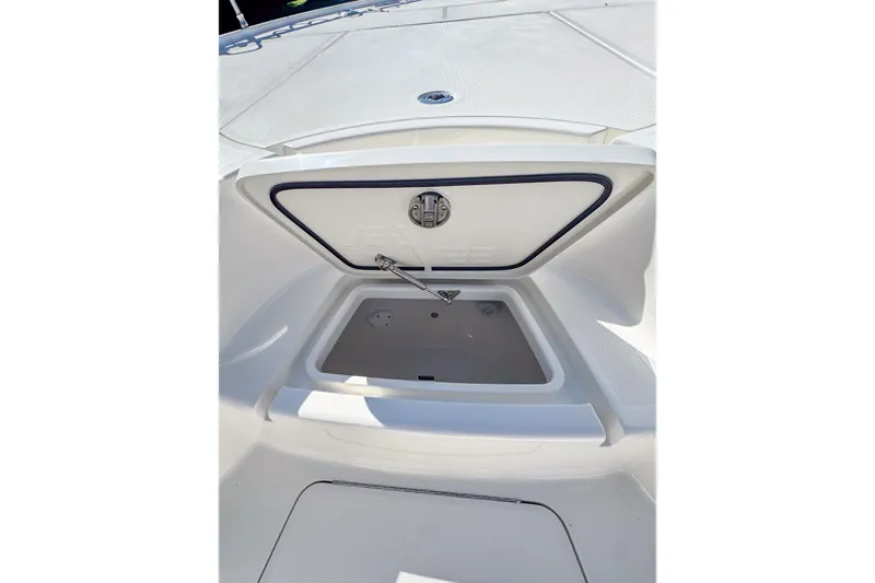 Slide: The Image of Open storage compartment on 2026 SeaVee 270Z boat deck. - 18
