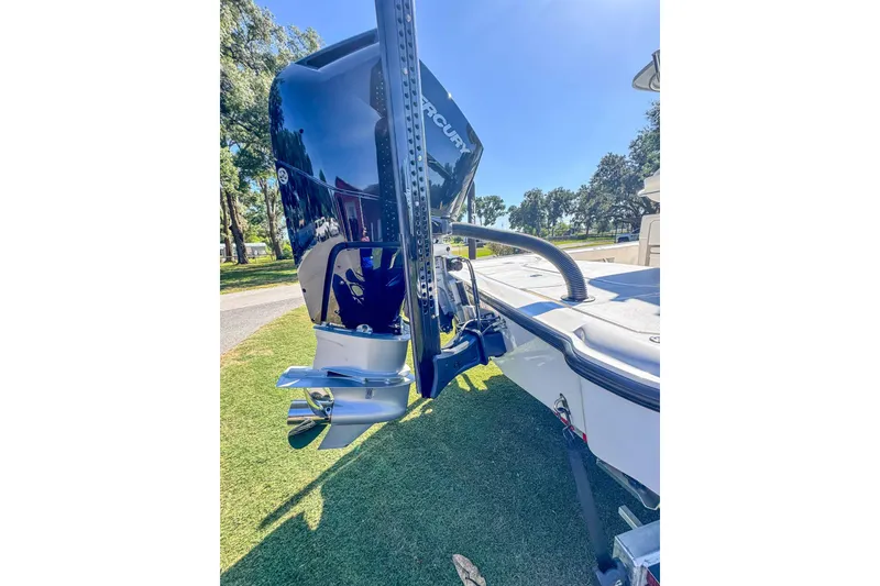 Slide: The Image of 2026 SeaVee 270Z boat with Mercury outboard engine, parked on grass. - 20