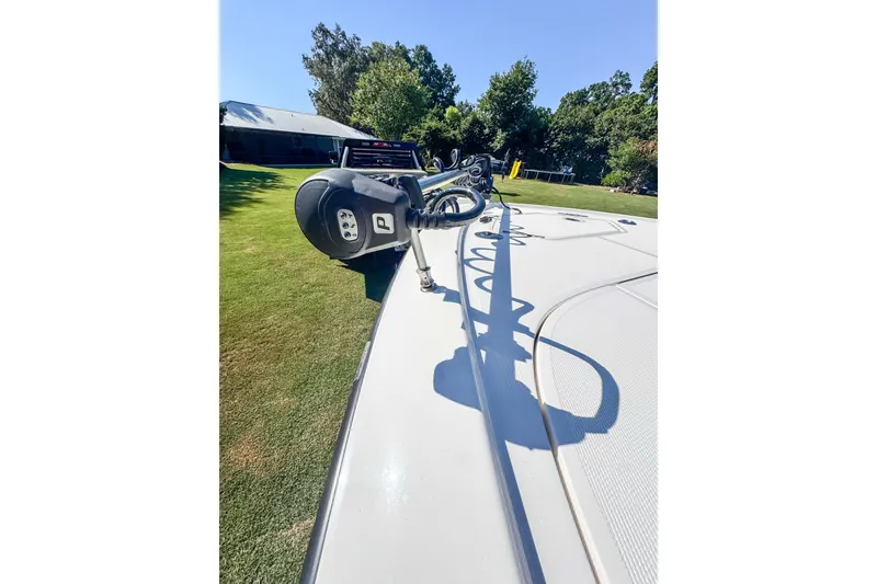 Slide: The Image of 2026 SeaVee 270Z boat on grass, showcasing deck and equipment under clear sky. - 22