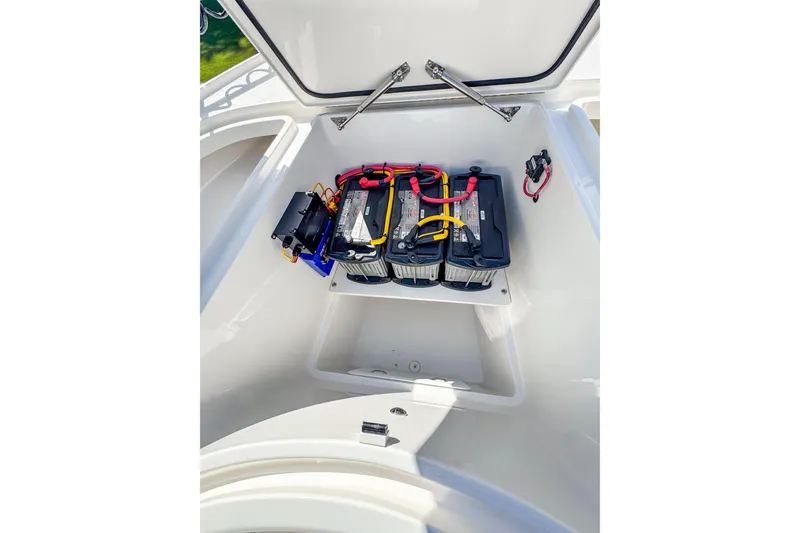 Slide: The Image of Battery compartment of 2026 SeaVee 270Z boat, showcasing organized wiring and secure installation. - 24