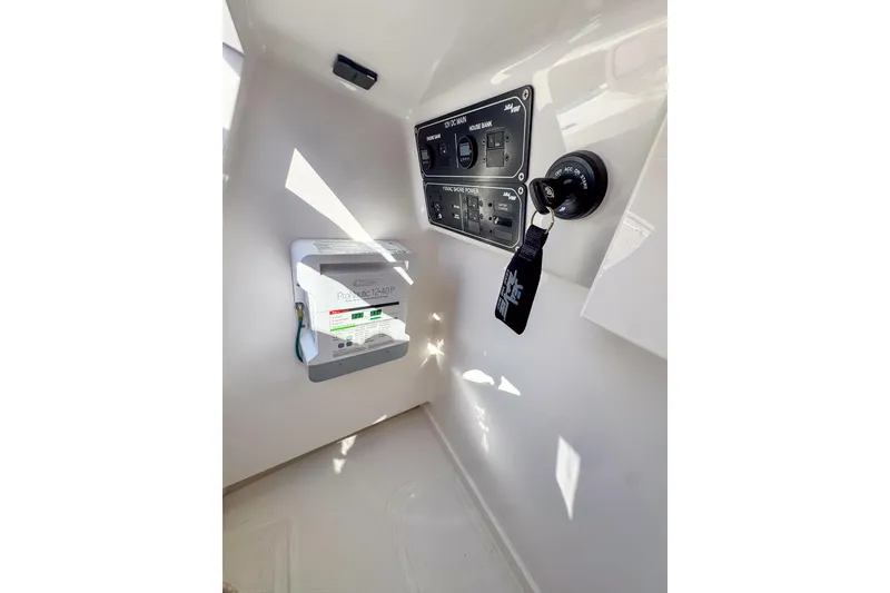 Slide: The Image of 2026 SeaVee 270Z boat interior control panel with key and electrical system. - 25