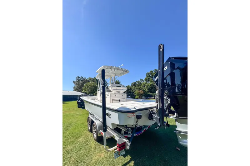Slide: The Image of 2026 SeaVee 270Z boat on trailer, parked on grass under clear blue sky. - 3
