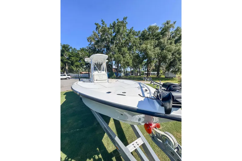 Slide: The Image of 2026 SeaVee 270Z boat on trailer, surrounded by trees and clear blue sky. - 4