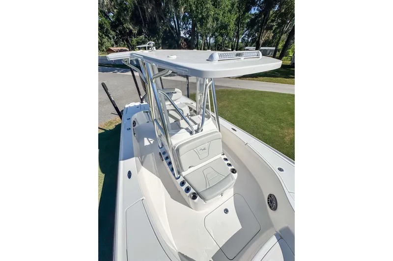 Slide: The Image of 2026 SeaVee 270Z boat with sleek design and modern features, docked outdoors. - 8