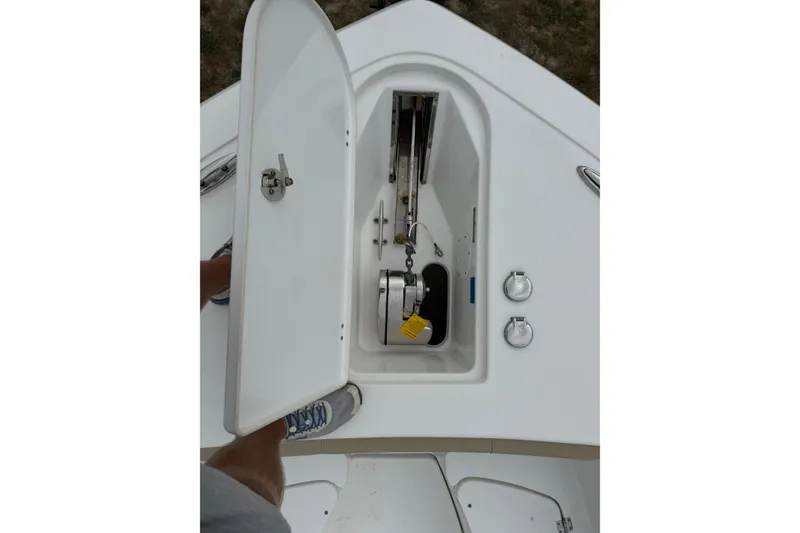 Slide: The Image of Open anchor compartment on 2022 Tidewater 272 CC Adventure boat. - 11