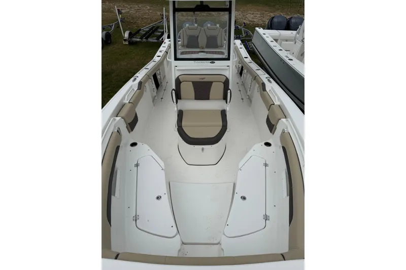 Slide: The Image of 2022 Tidewater 272 CC Adventure boat interior with seating and storage compartments. - 10