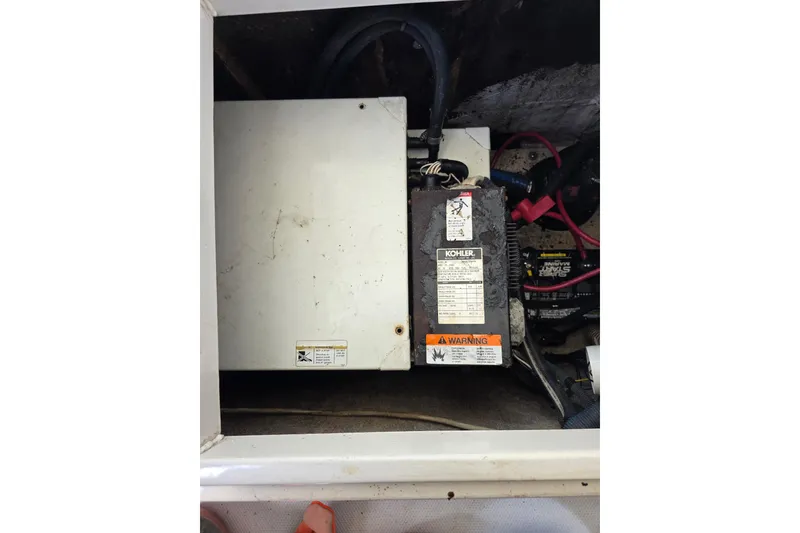 Slide: The Image of 2007 Seaswirl Striper 2901 Walkaround O/B engine compartment with Kohler generator and wiring. - 10