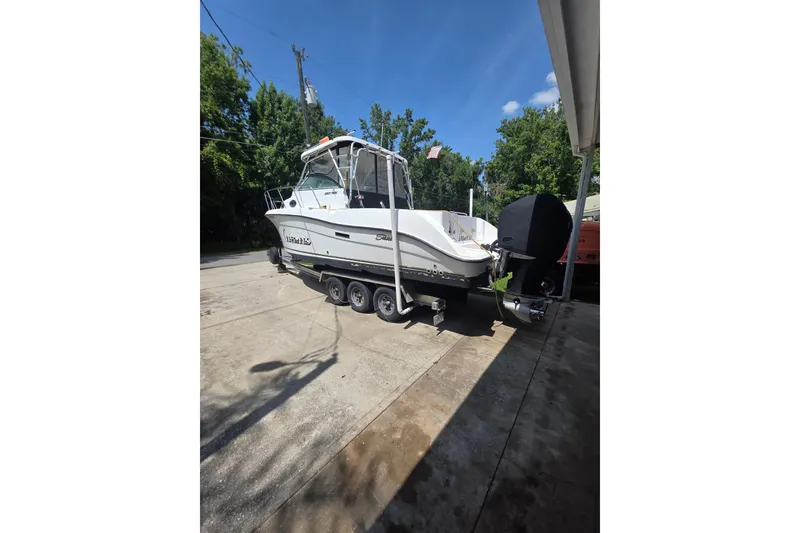 Slide: The Image of 2007 Seaswirl Striper 2901 Walkaround O/B boat on trailer, parked outdoors. - 3