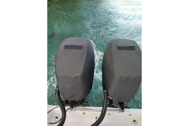 Slide: The Image of Twin outboard motors on a 2007 Seaswirl Striper 2901 Walkaround O/B, covered and ready for action. - 7