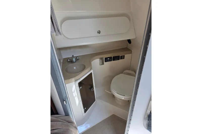 Slide: The Image of 2007 Seaswirl Striper 2901 Walkaround O/B boat bathroom with sink and toilet. - 9