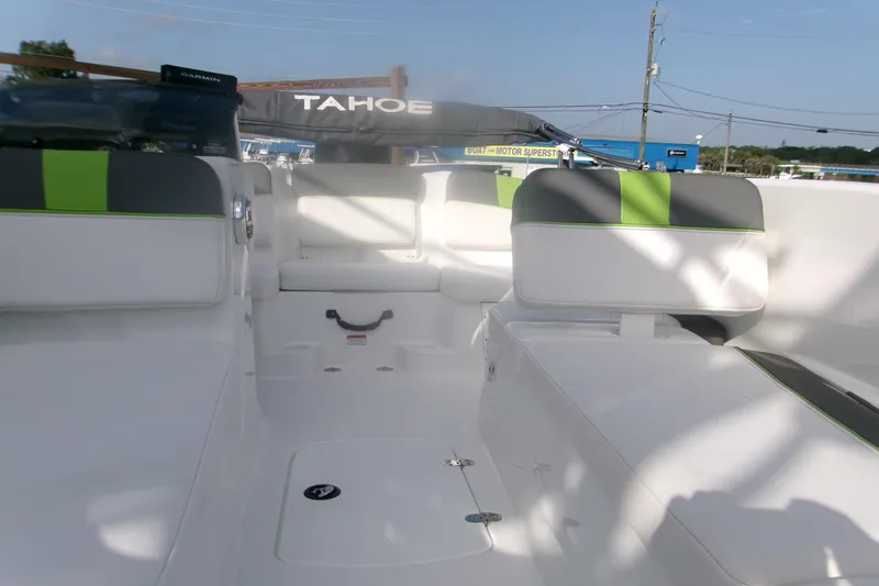 Slide: The Image of 2024 Tahoe T16 boat interior with white and green seating, showcasing modern design. - 11