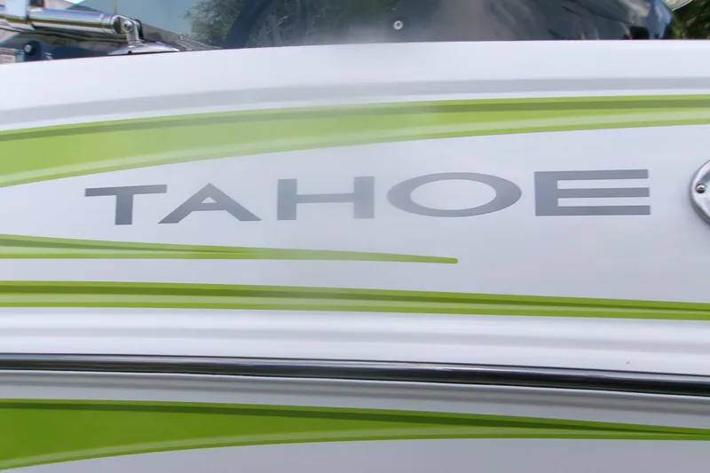 Slide: The Image of 2024 Tahoe T16 boat with green and white design, showcasing brand logo. - 12