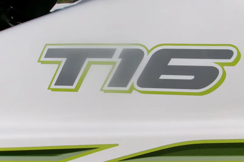 Slide: The Image of Close-up of 2024 Tahoe T16 logo with green outline on white background. - 13
