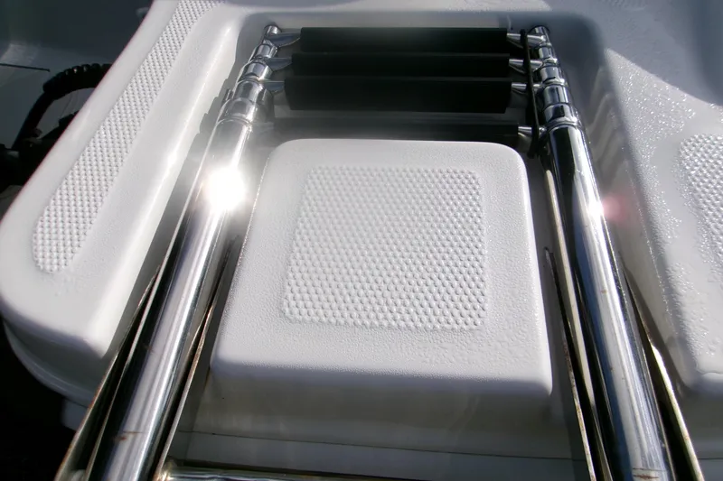 Slide: The Image of 2024 Tahoe T16 boat ladder with textured grip and chrome finish. - 7
