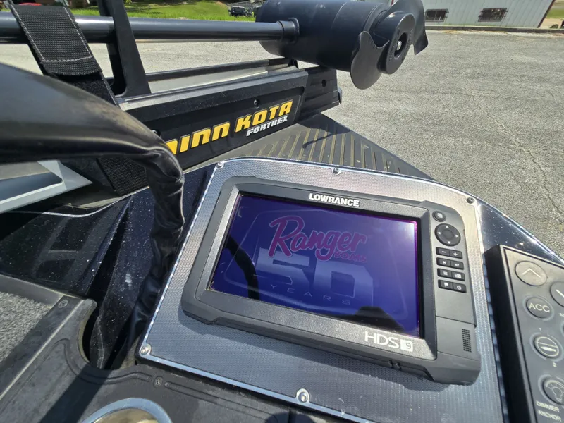 Slide: The Image of Close-up of a boat control system with a Lowrance screen and Minn Kota motor. - 11