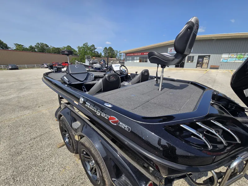 Slide: The Image of A black 2018 Ranger Z521 Comanche boat on a trailer in a parking lot. - 22