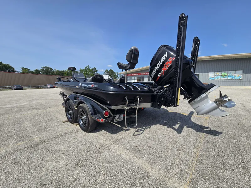 Slide: The Image of A black 2018 Ranger Z521 Comanche boat on a trailer in a parking lot. - 8