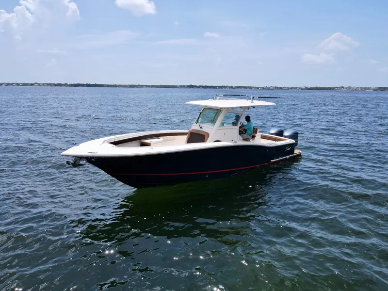 Slide: The Image of 2014 Scout 320 LXF on the water - 1