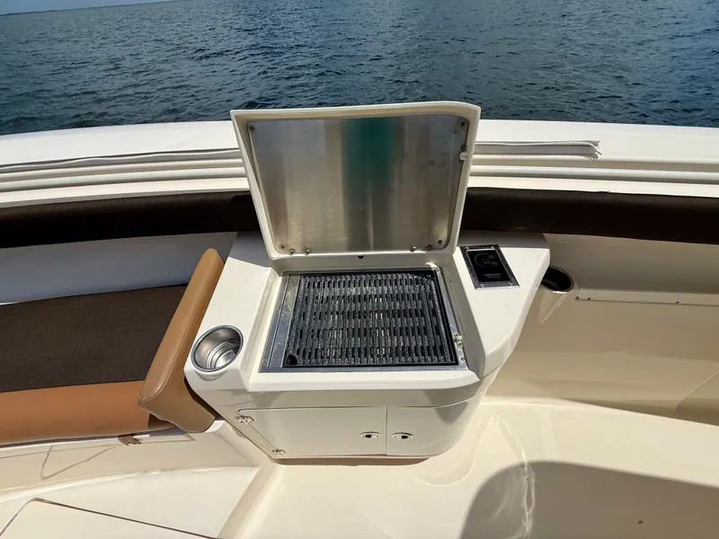Slide: The Image of A grill on a boat overlooking the sea. - 10