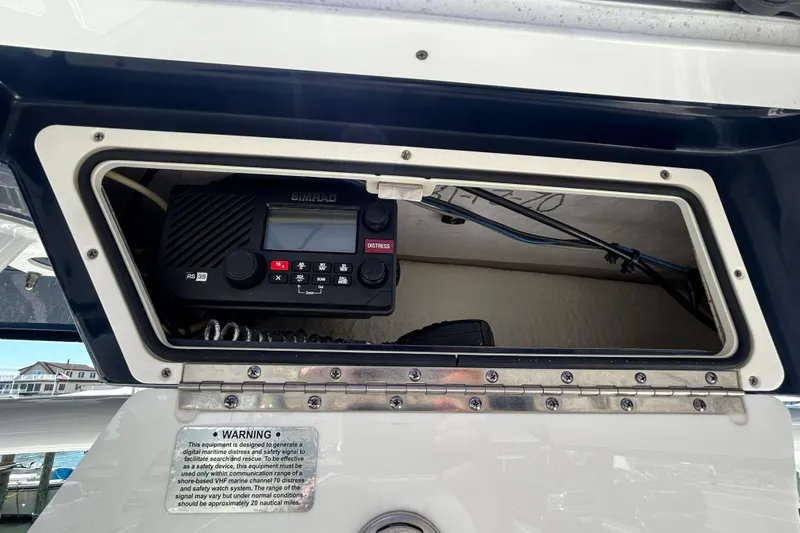 Slide: The Image of 2018 Sea Fox 266 Commander boat radio compartment with Simrad RS35 marine radio. - 17