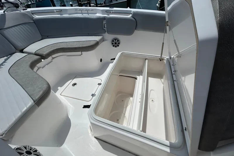 Slide: The Image of 2018 Sea Fox 266 Commander boat interior with open storage compartment and cushioned seating. - 24