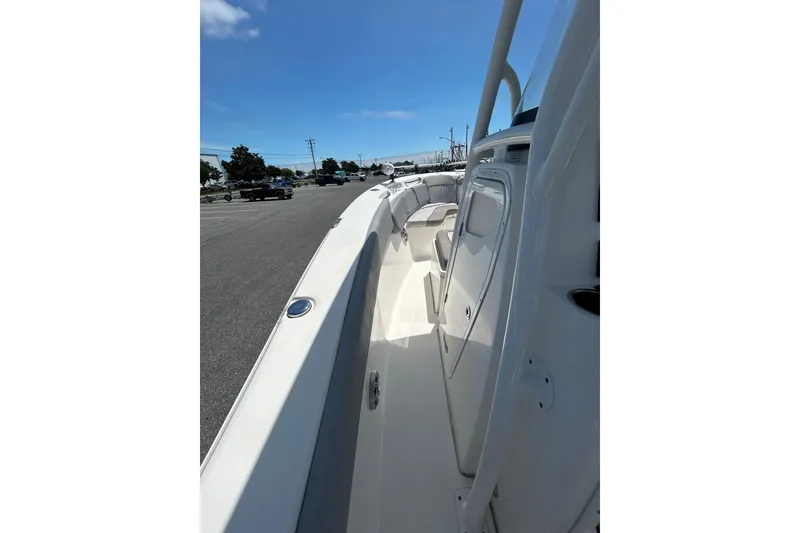 Slide: The Image of 2018 Sea Fox 266 Commander boat deck view, showcasing sleek design and spacious seating. - 21