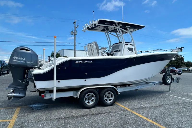 Slide: The Image of 2018 Sea Fox 266 Commander boat on trailer with Yamaha outboard motor, parked outdoors. - 7