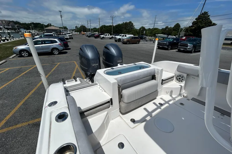 Slide: The Image of 2018 Sea Fox 266 Commander boat with dual engines in a parking lot. - 11