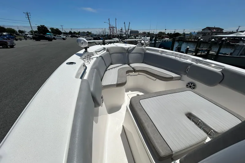 Slide: The Image of 2018 Sea Fox 266 Commander boat interior with cushioned seating and cup holders. - 23