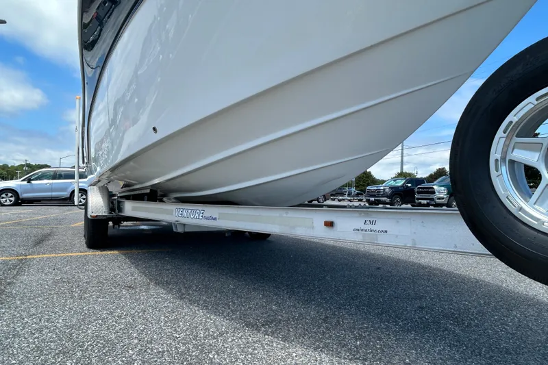 Slide: The Image of 2018 Sea Fox 266 Commander boat on Venture trailer in parking lot. - 2