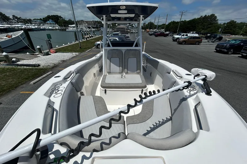 Slide: The Image of 2018 Sea Fox 266 Commander boat docked, featuring spacious seating and modern design. - 26
