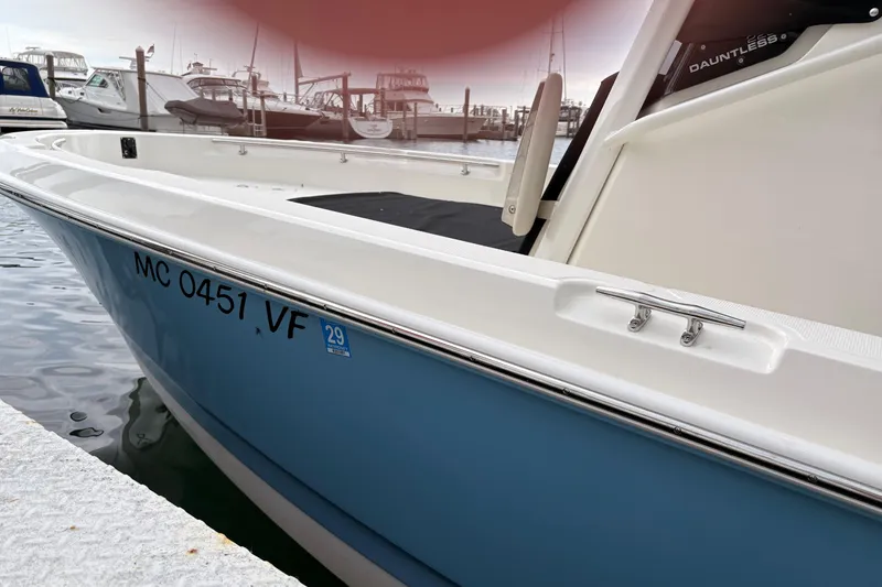 The Image of 2026 Boston Whaler 22 Dauntless boat docked, displaying registration number MC 0451 VF. - 1