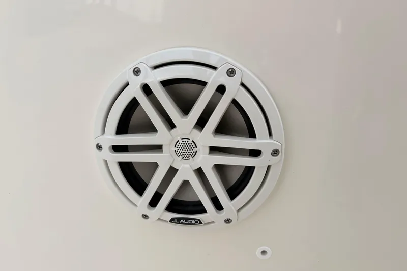Slide: The Image of White JL Audio speaker on 2026 Boston Whaler 22 Dauntless boat. - 15