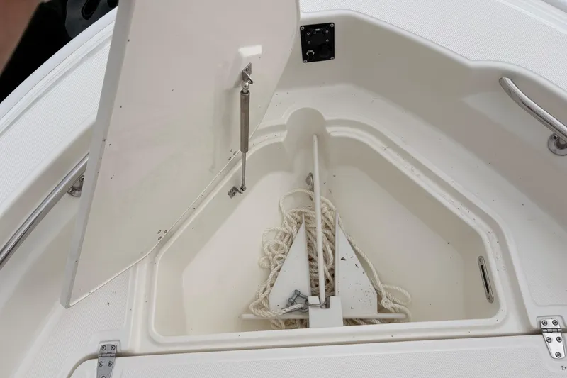 Slide: The Image of Anchor storage compartment on a 2026 Boston Whaler 22 Dauntless boat. - 17