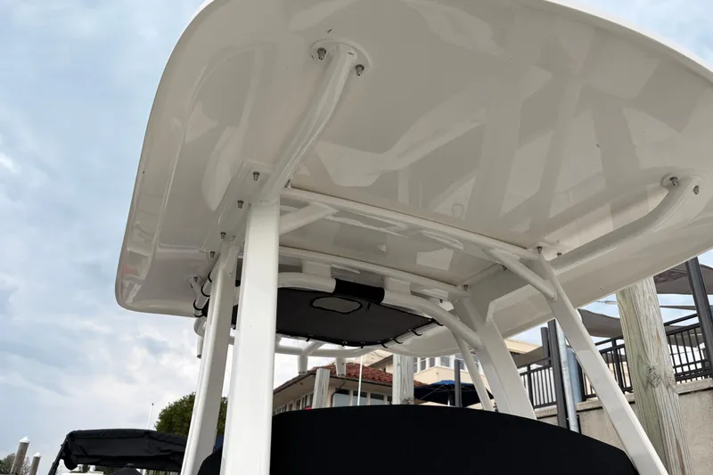 Slide: The Image of 2026 Boston Whaler 22 Dauntless boat canopy, showcasing sleek design and sturdy construction. - 19