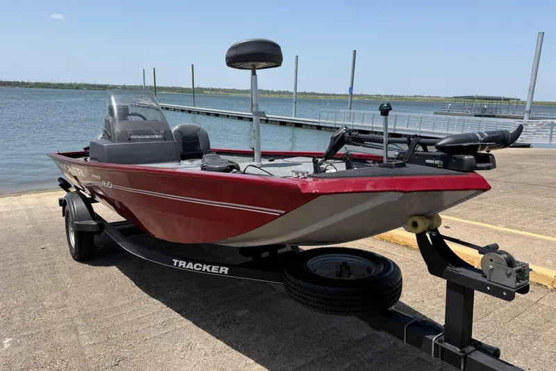Slide: The Image of 2019 Tracker Pro 160 boat on trailer by a lake dock. - 16
