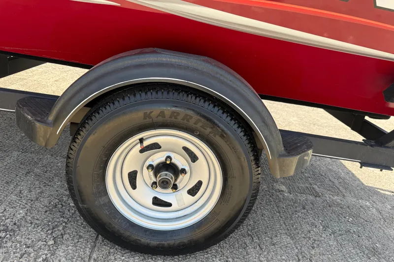 Slide: The Image of Trailer wheel of a 2019 Tracker Pro 160 boat, featuring Karr tires. - 30