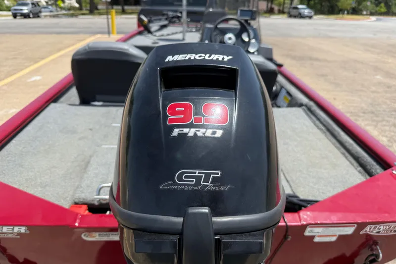 Slide: The Image of 2019 Tracker Pro 160 boat with Mercury 9.9 Pro outboard motor, parked outdoors. - 10