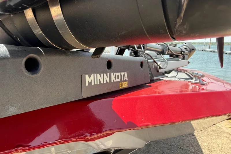 Slide: The Image of Minn Kota Edge motor on 2019 Tracker Pro 160 boat, docked by the water. - 19