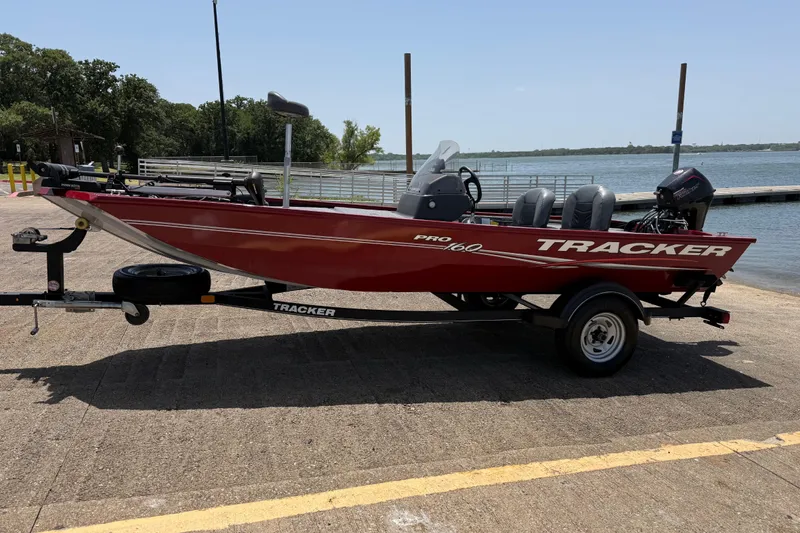 Slide: The Image of 2019 Tracker Pro 160 boat on trailer by a lake, ready for launch. - 3