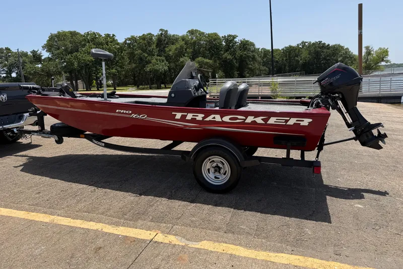 Slide: The Image of 2019 Tracker Pro 160 boat on trailer, parked outdoors, side view. - 6